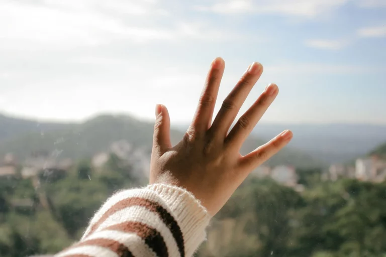 close up photo of hand on glass 1123791 1